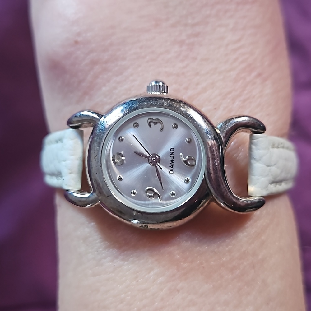 Elegant Avon Silver Watch with Slim White Faux Leather Band & Faux Diamond at 12